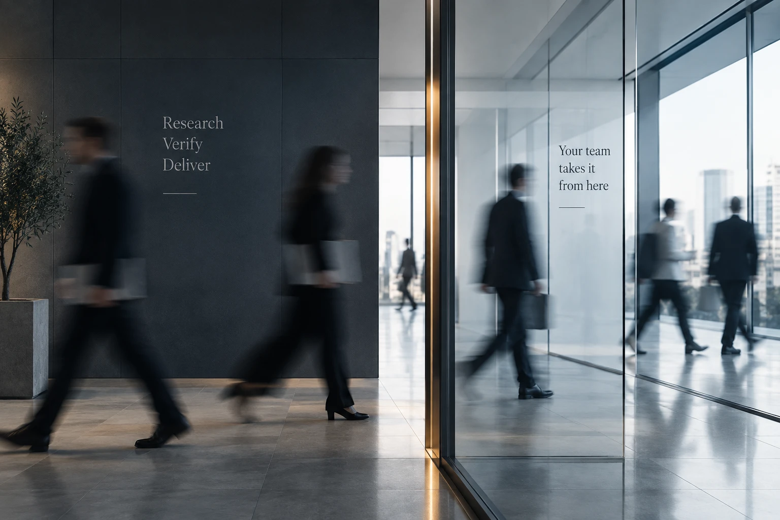 People in motion blur crossing a bright office lobby past a dark wall lettered Research, Verify, Deliver, and a glass partition that reads Your team takes it from here
